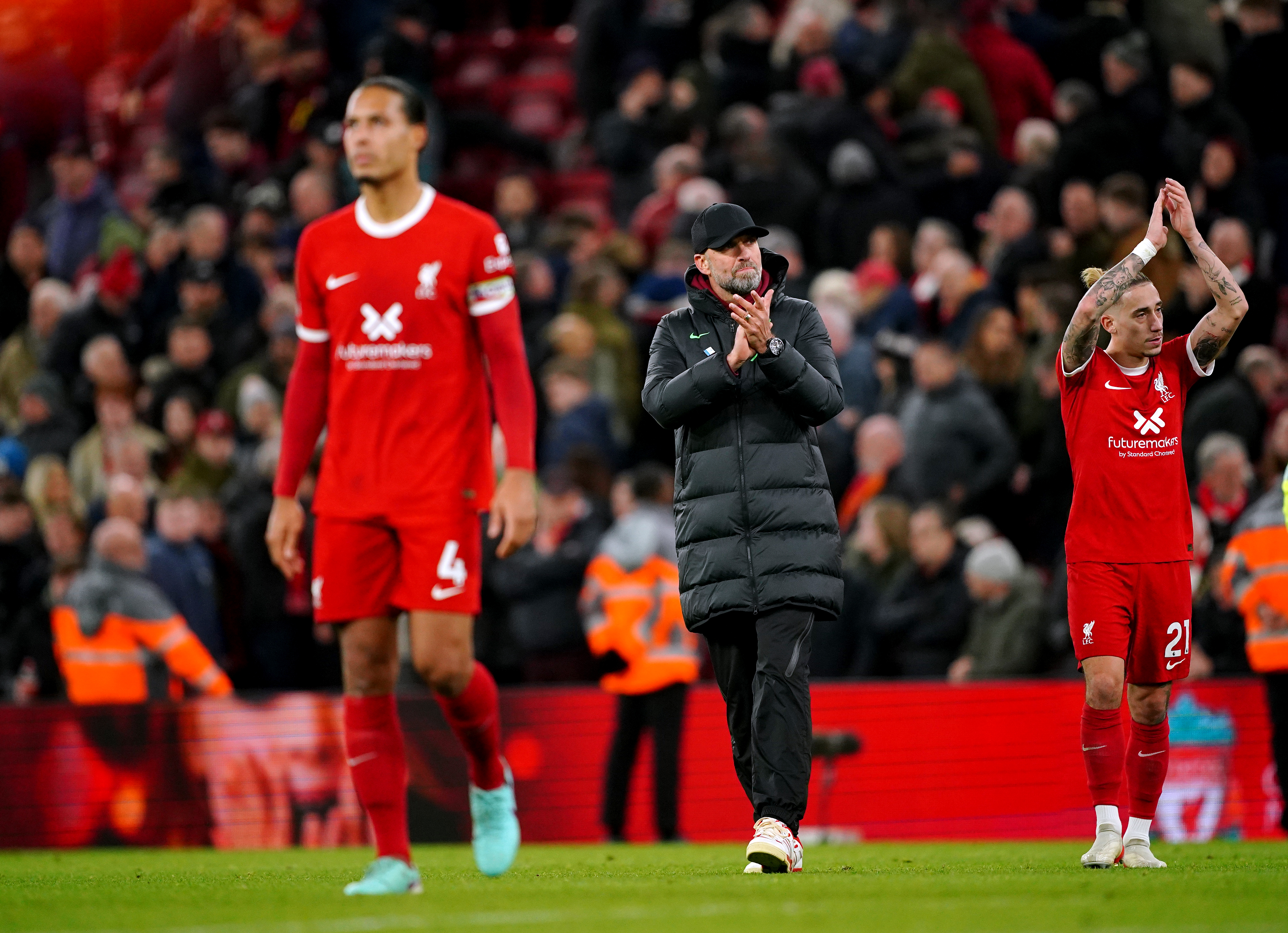 Liverpool manager Jurgen Klopp (centre) applauds the fans (Peter Byrne/PA)