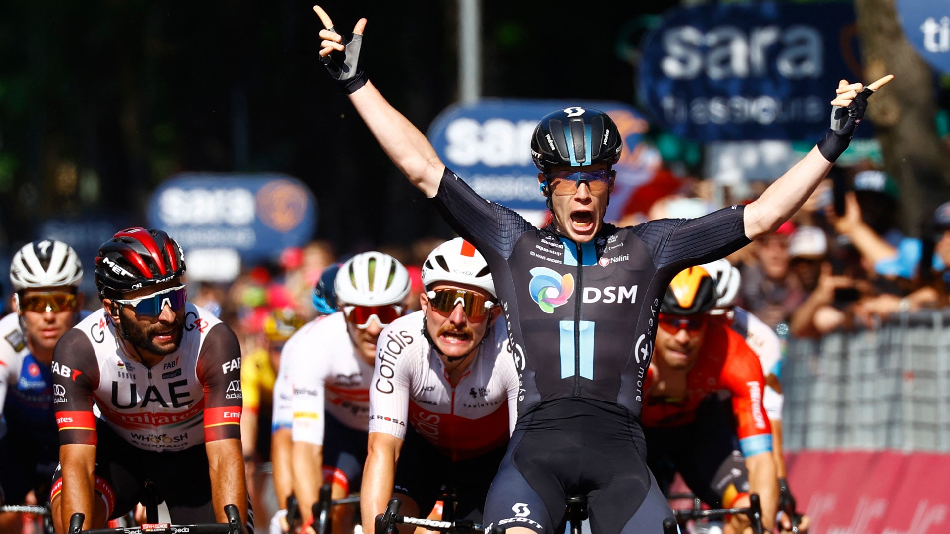 Alberto Dainese celebrates his stage 11 win