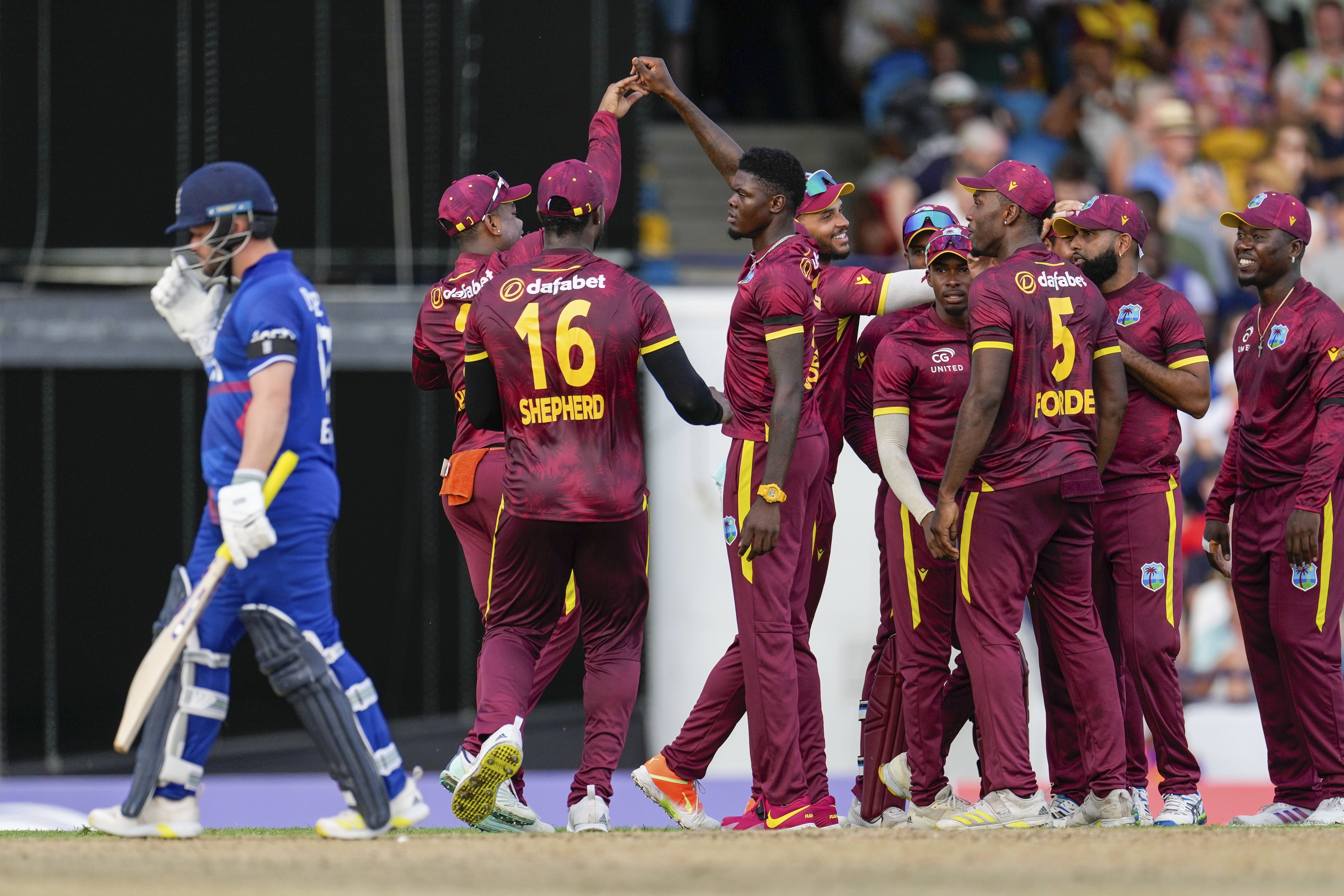 Jos Buttler, left, trudged off for a golden duck in England's defeat in the third ODI (Ricardo Mazalan/AP)