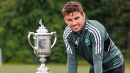 Celtic’s Matt O’Riley alongside the Scottish Cup (Steve Welsh/PA)
