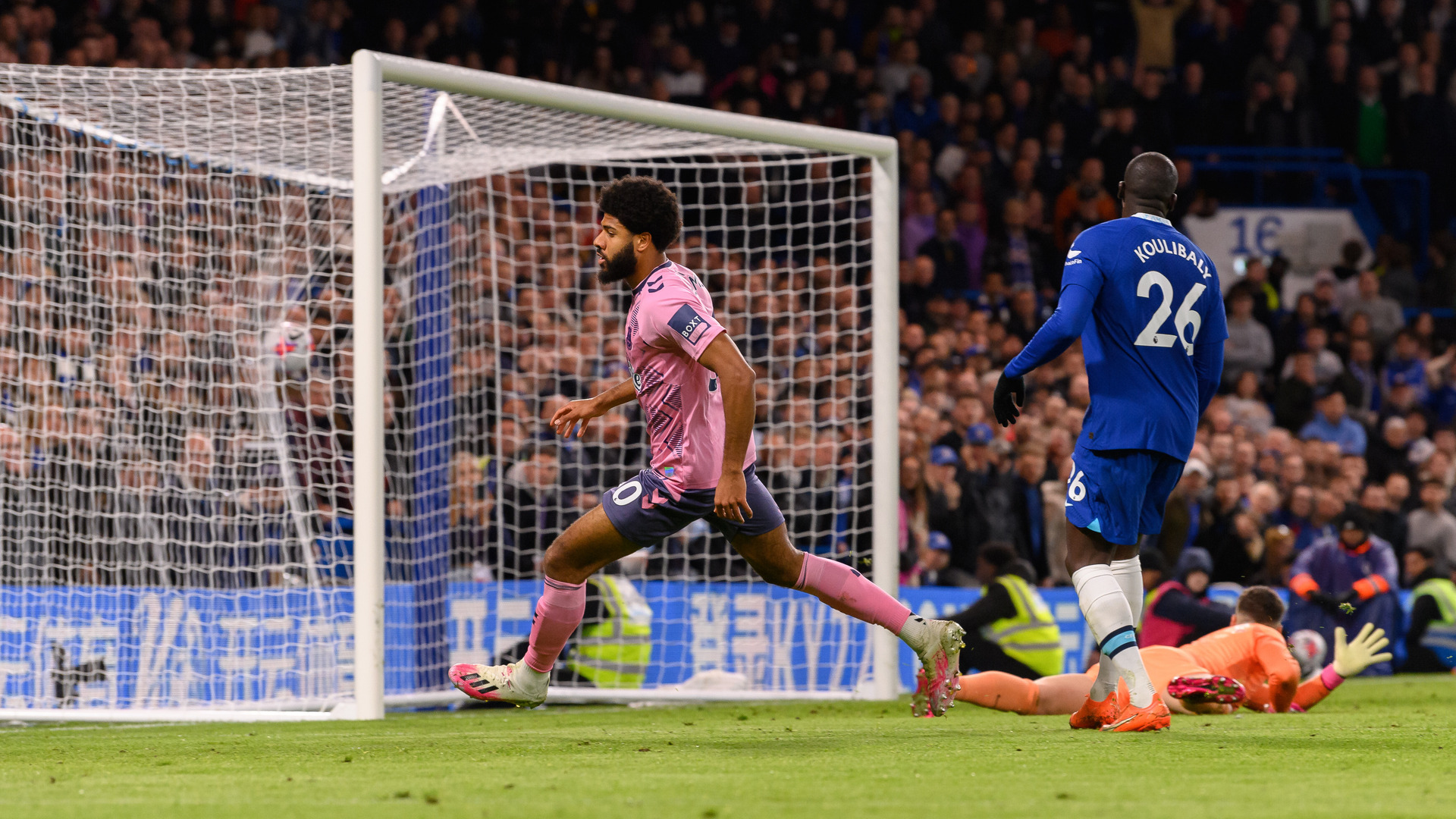 Ellis Simms, in pink, runs off in celebration of his equaliser against Chelsea