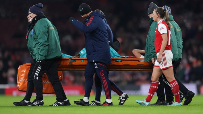 Vivianne Miedema is carried from the field after sustaining an injury against Lyon