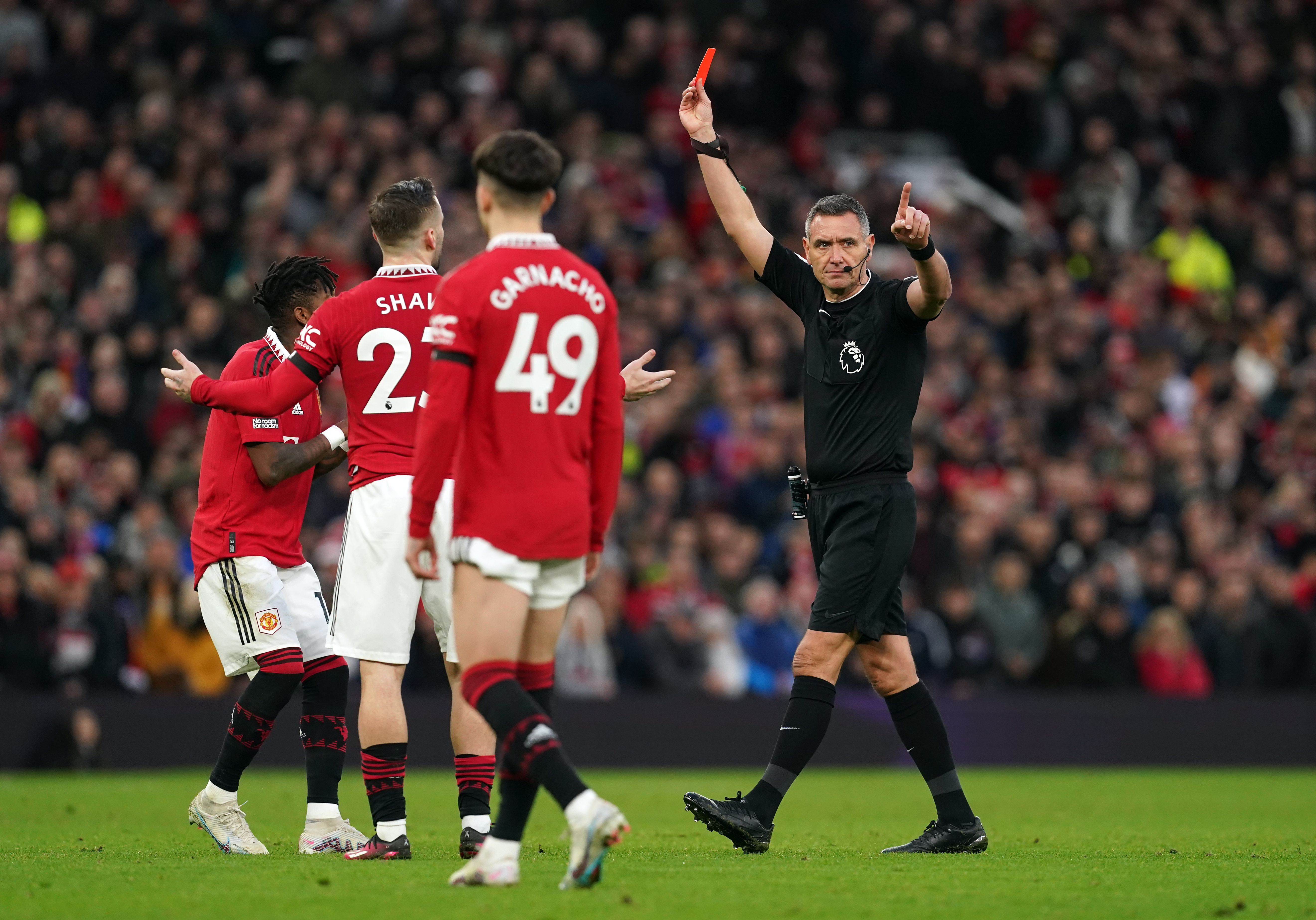 Referee Andre Marriner sends off Manchester United’s Casemiro (not pictured)