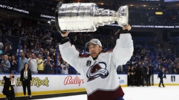 Darcy Kuemper celebrates winning the Stanley Cup with the Avs