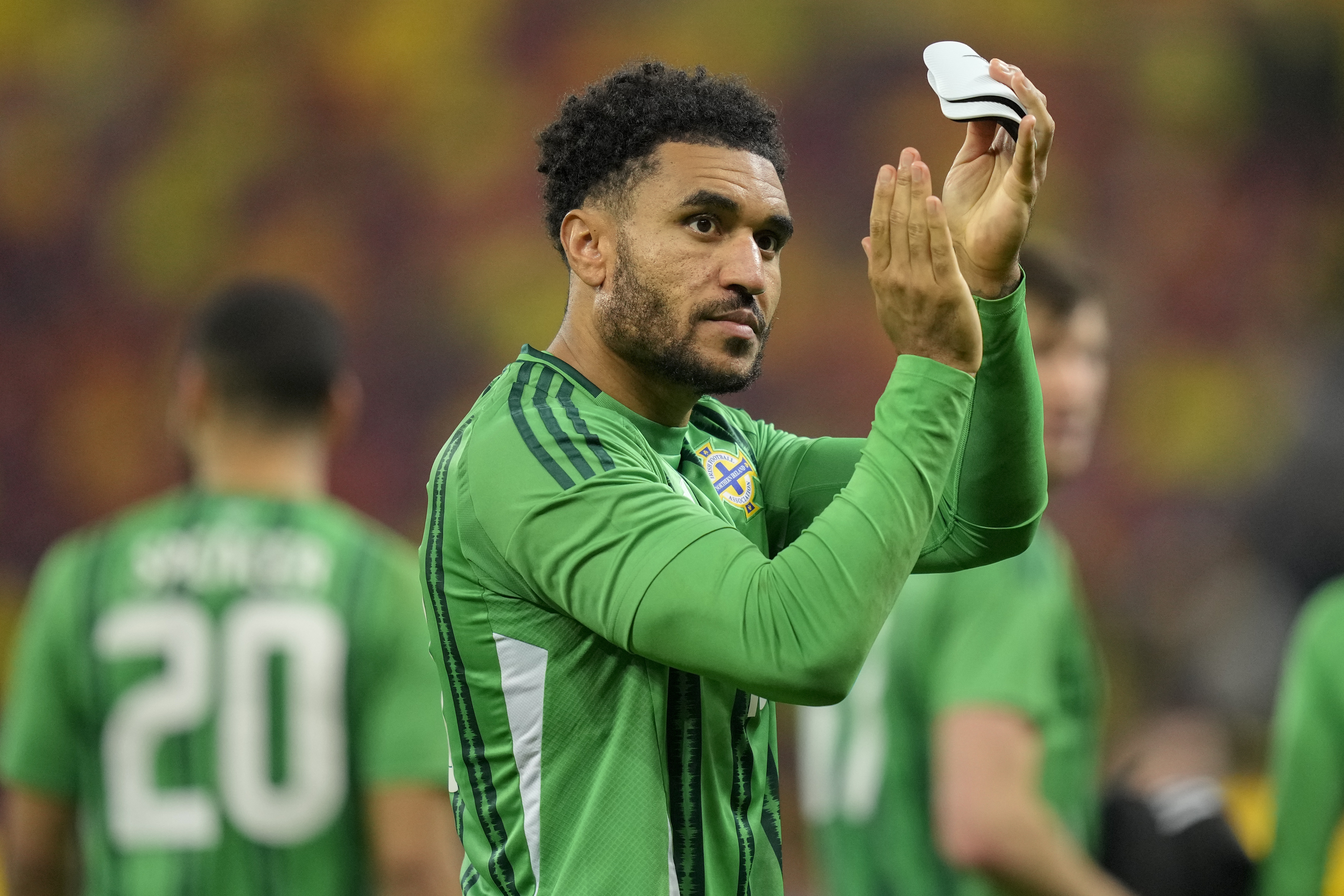 Northern Ireland’s Jamie Reid applauds the fans