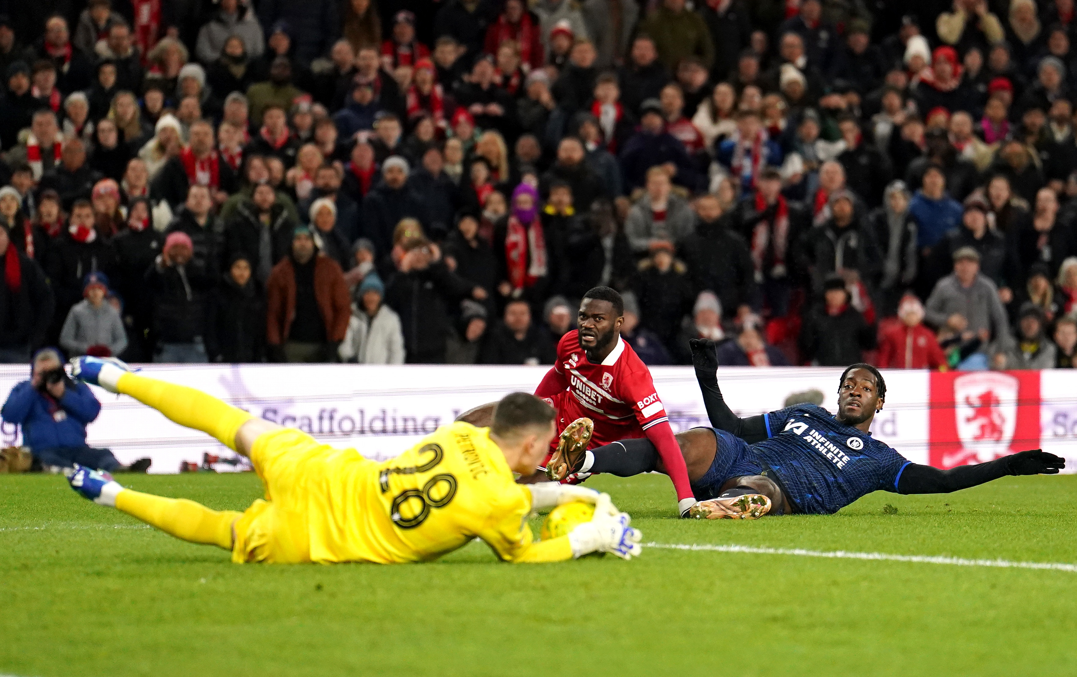 Emmanuel Latte Lath, centre, sees his shot saved by Chelsea goalkeeper Djordje Petrovic, left