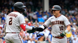 Josh Rojas (right) celebrates one of his three home runs against the Chicago Cubs