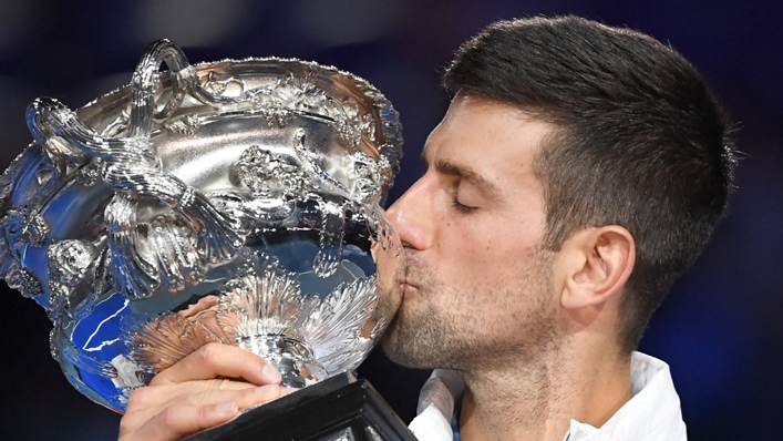 Novak Djokovic plants a kiss on the Norman Brookes Challenge Cup