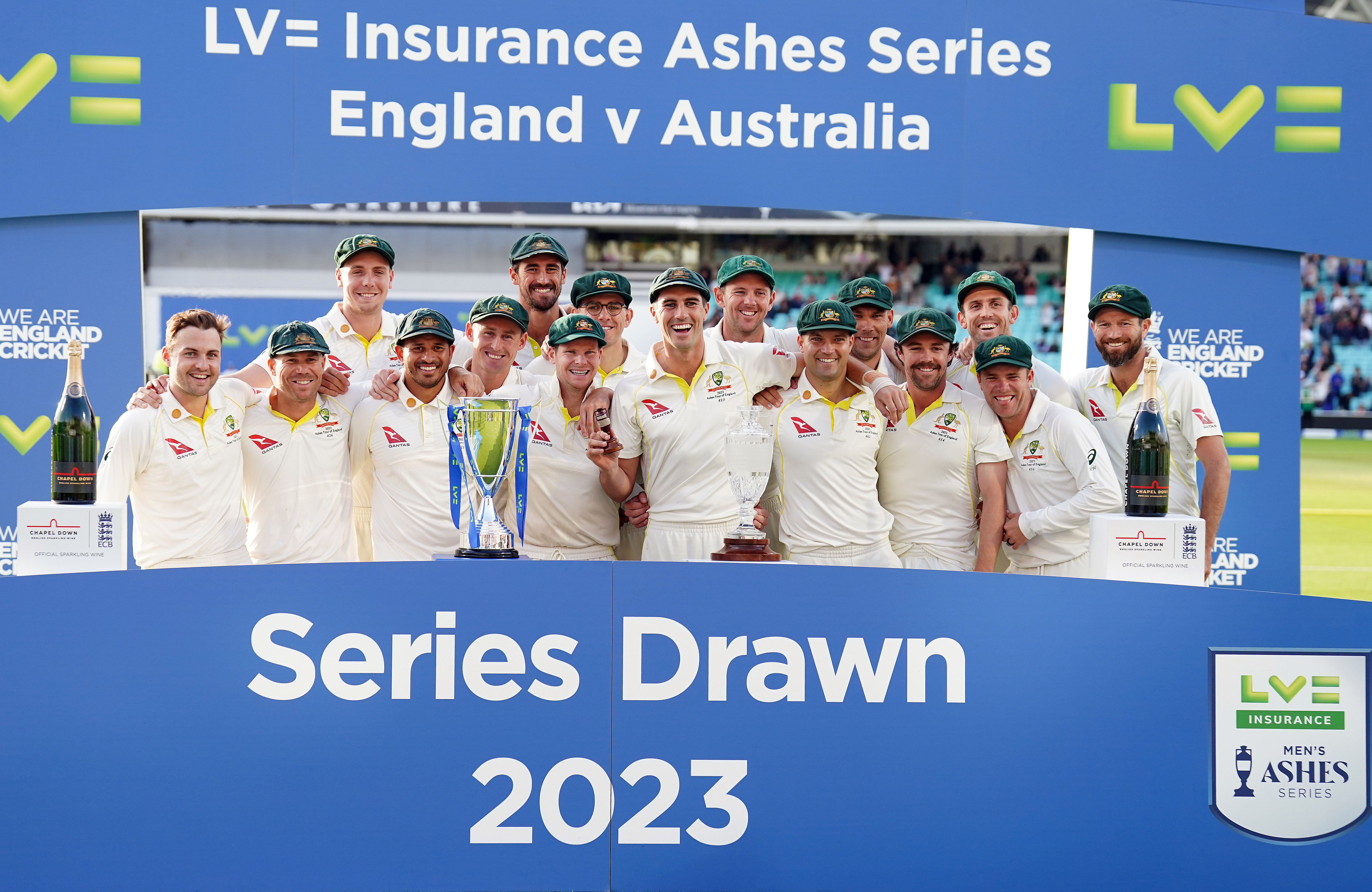 Australia captain Pat Cummins and team-mates celebrate with the urn