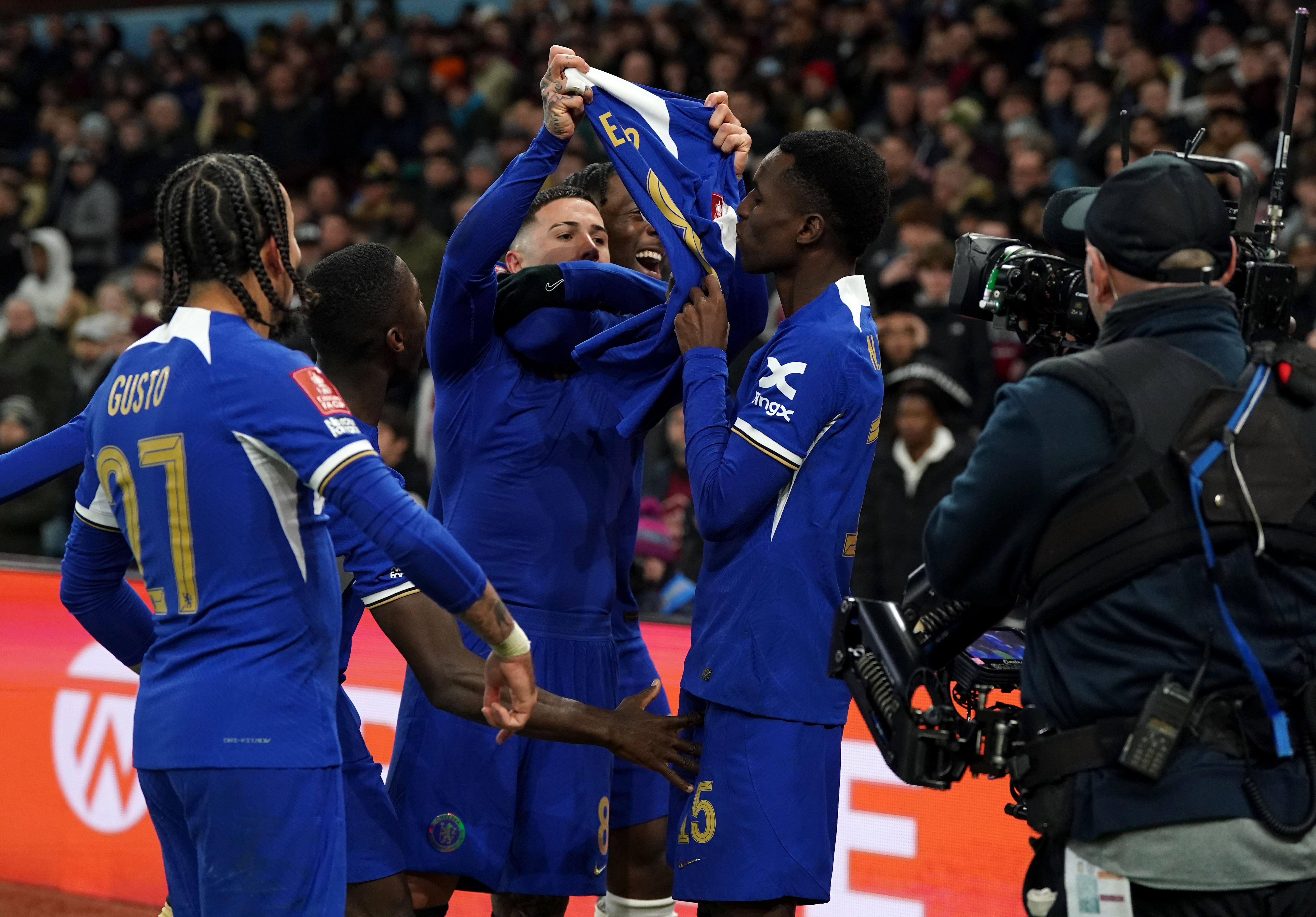 Enzo Fernandez (centre) celebrates his stunning free-kick goal