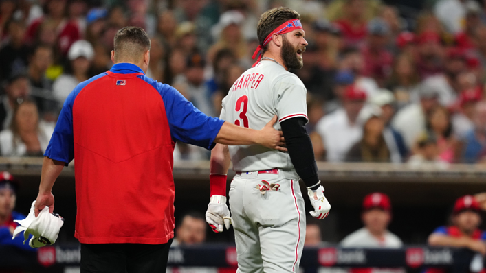 Bryce Harper of the Philadelphia Phillies reacts as he leaves the field after being hit on the thumb by a pitch against the San Diego Padres