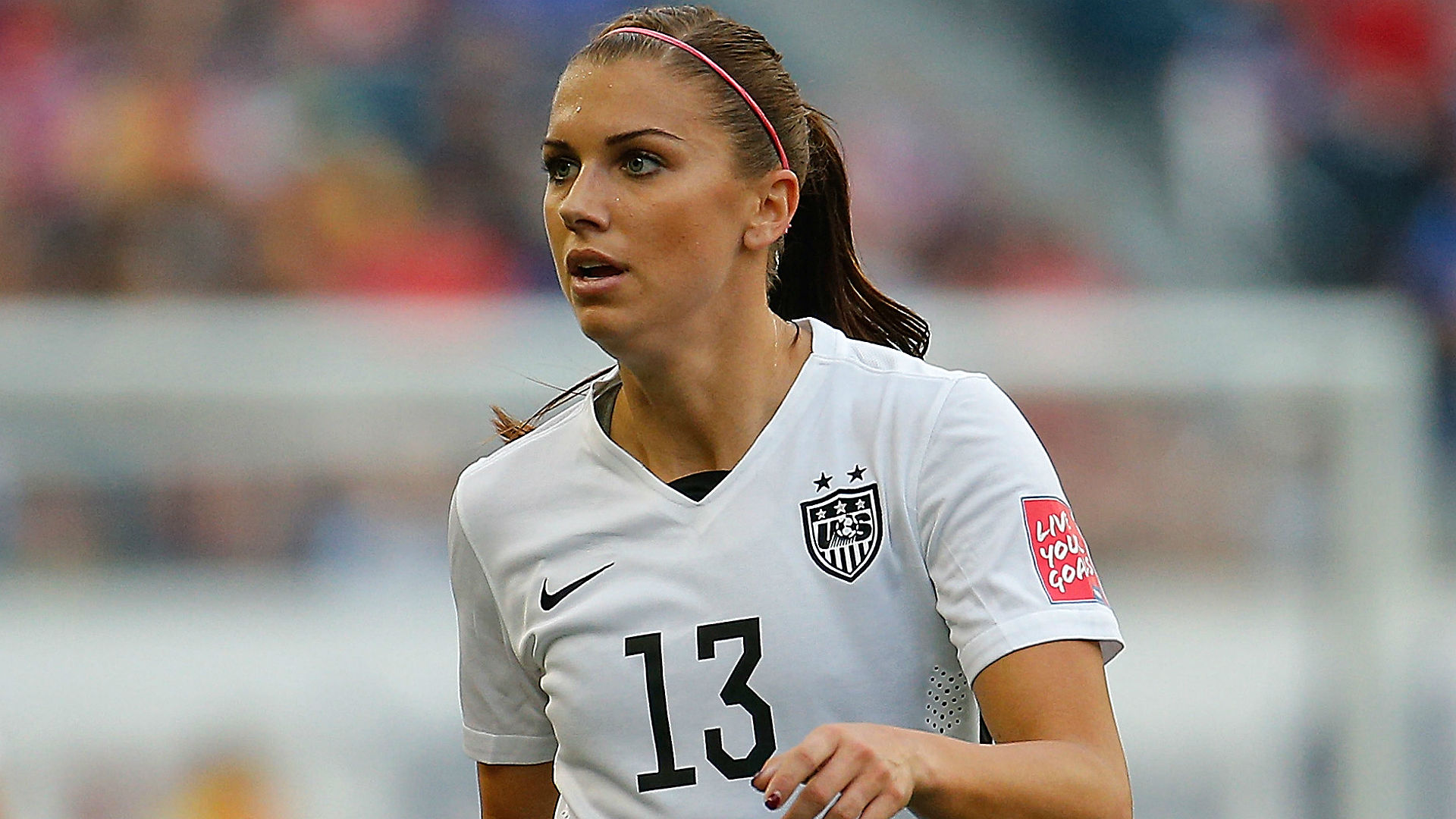 Alex Morgan wearing her pink headband.